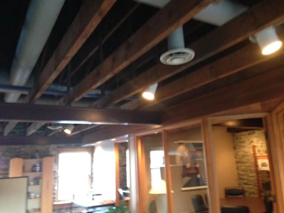 A room with wooden beams on the ceiling.