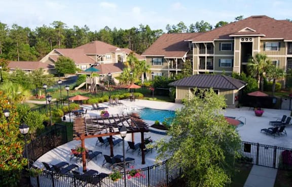 A large house with a pool and a gazebo.