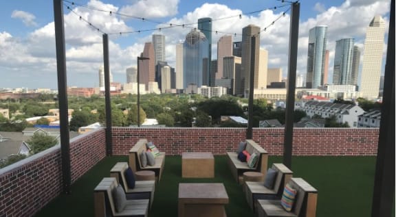rooftop lounging area with sweeping Houston city views at Tinsley on the Park apartments