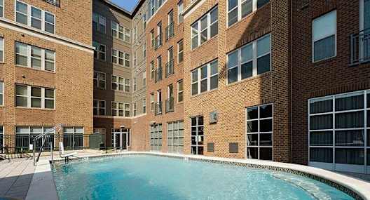 A swimming pool in a brick building.