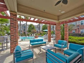 Covered poolside seating with ceiling fan