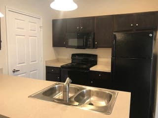 Sleek, black appliance package at CLEAR Property Management , The Lookout at Comanche Hill, San Antonio, Texas