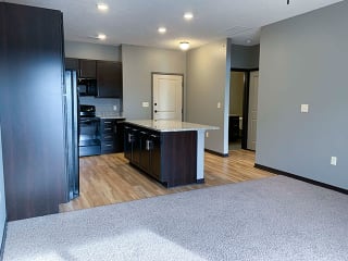 Spacious kitchen with a large island with light granite counter tops  of 1 bedroom apartment for rent at The Flats at 84 best   apartments Lincoln NE 68516