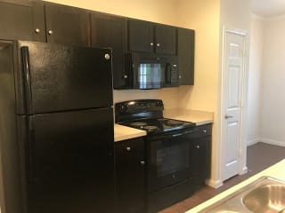 Sleek, black appliance package at CLEAR Property Management , The Lookout at Comanche Hill, San Antonio, Texas