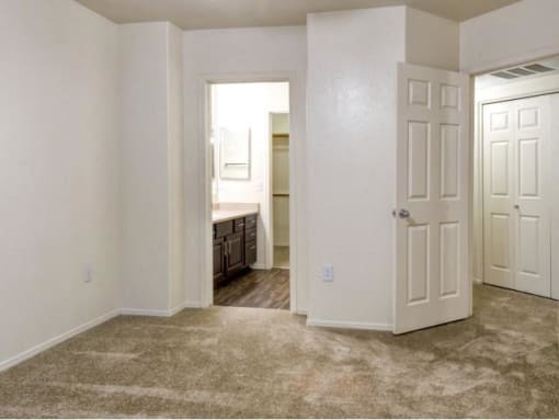 Ingleside Apartments Bedroom with wall to wall carpet and attached bathroom