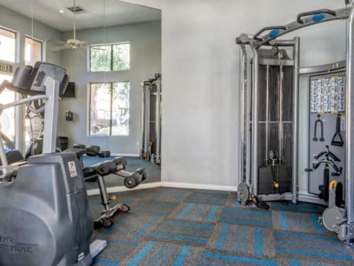 Ingleside Apartments Fitness Center with cardio and weight machines