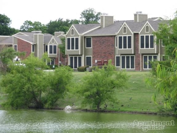 a group of houses next to a body of water