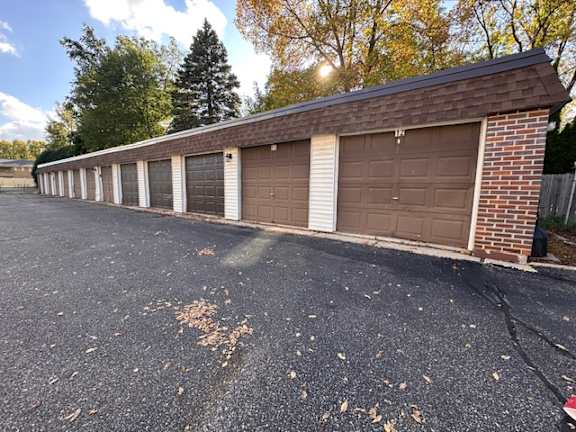 A long building with a row of garage doors.