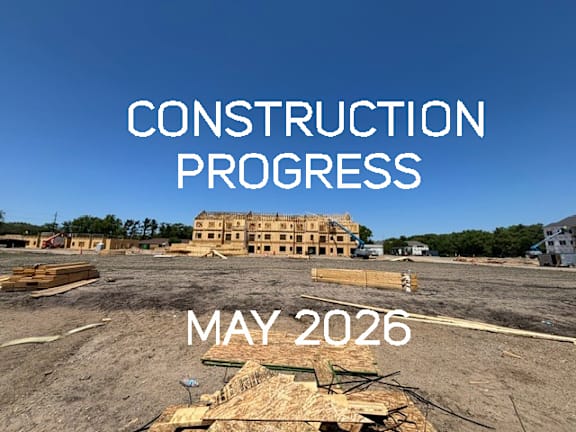 A construction site with the text "CONSTRUCTION PROGRESS MAY 2026" overlaid on the image.