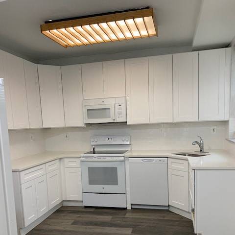 a small bathroom with a toilet and a microwave