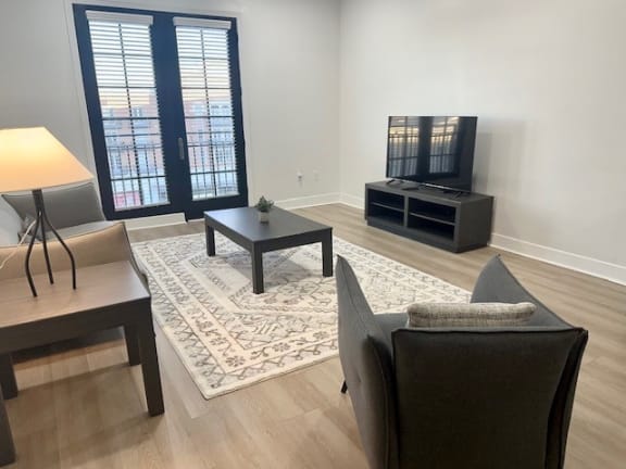 a living room with a couch a table and a television
