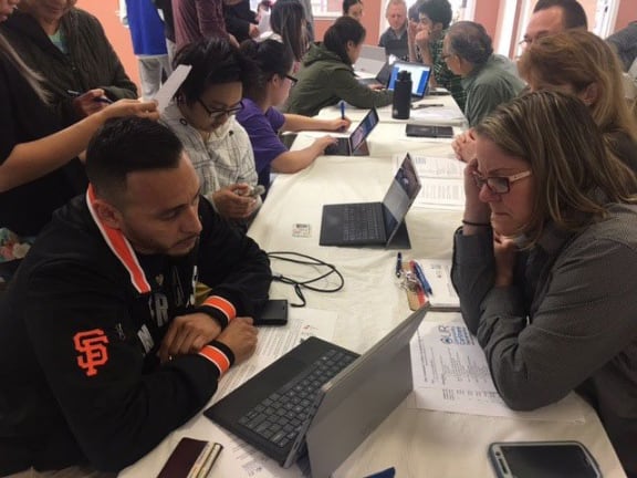 Residents signing up for programs at community event