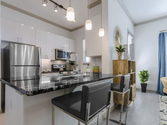 a kitchen with stainless steel appliances