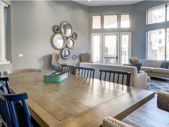 Ingleside Apartments Clubhouse dining table with blue wooden chairs