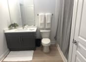 Thumbnail 10 of 13 - a small bathroom with a toilet and a sink
