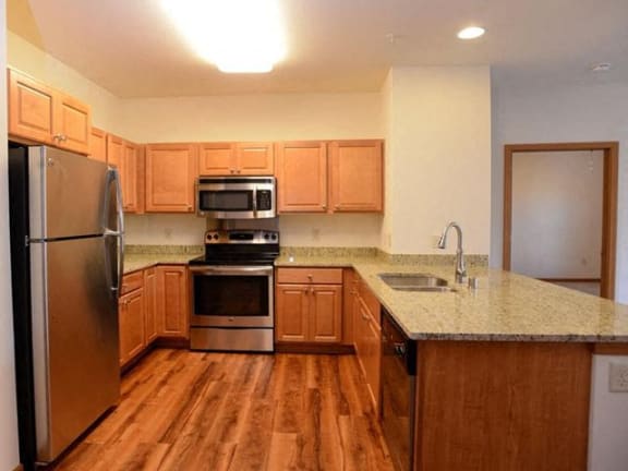 Kitchen at Highlands at Riverwalk Apartments 55+