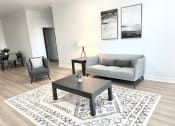 Thumbnail 5 of 13 - a living room with a couch and a coffee table