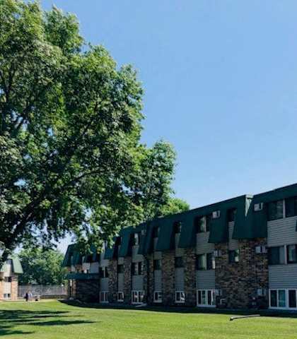 a large building with a tree in front of it