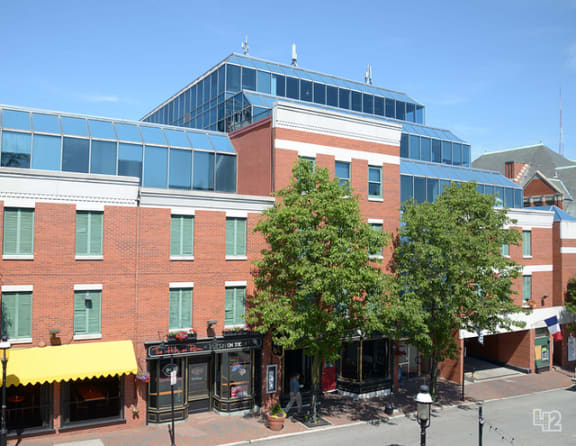 a large brick building with a yellow awning in front of it