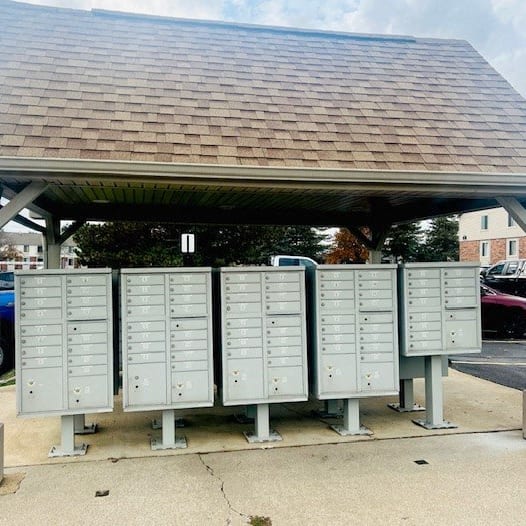 a row of mailboxes sitting under a shelter