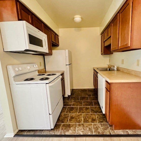 a kitchen with a stove microwave and refrigerator