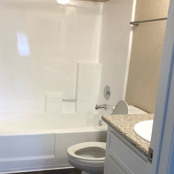 a bathroom with a toilet sink and bathtub