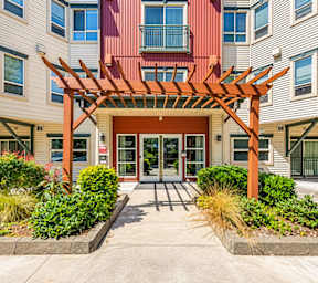 Apartment complex with multiple buildings and garages.