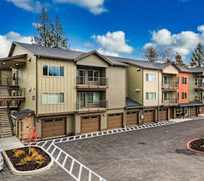 Apartment complex with multiple buildings and garages.
