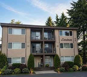 Apartment complex with multiple buildings and garages.