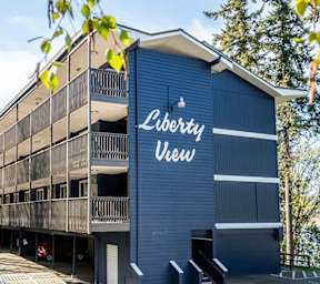 Apartment complex with multiple buildings and garages.