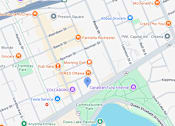 Thumbnail 4 of 4 - A map shows a section of a city with streets, parks, and landmarks.