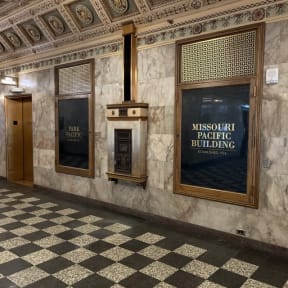 the lobby of a building with a sign for the museum of fabric building