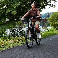 A person riding a bicycle on a road.