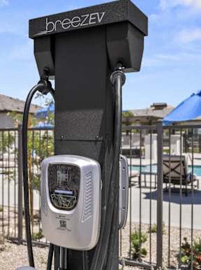 A BreezeV charger is installed on a pole outside at Zora Encanto, Phoenix, 85035
