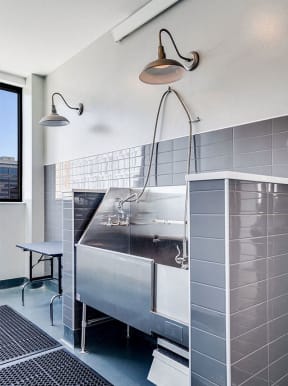 a kitchen with a stainless steel sink and a large window