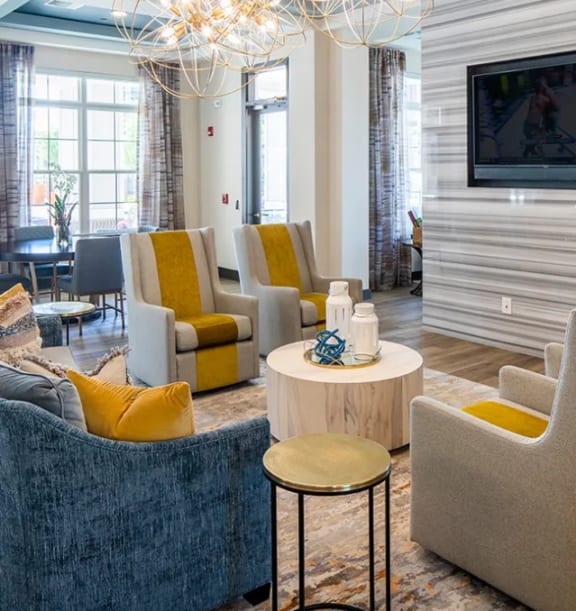 a kitchen and living room with a table and chairs at Canopy at Ginter Park Apartments, Richmond, VA, 23227