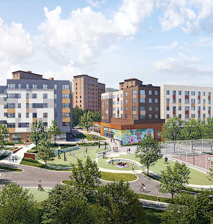 A park with a playground and apartment buildings in the background.