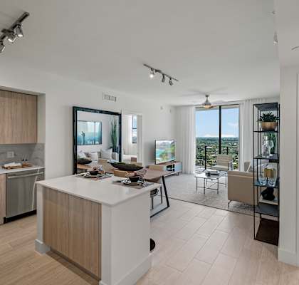 a kitchen and living room in a 555 waverly unit at Regatta at New River, Fort Lauderdale, FL