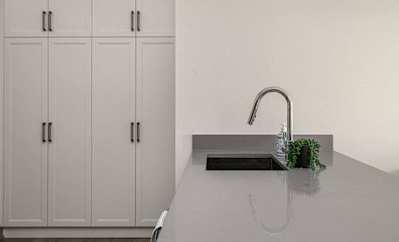 a kitchen with white cabinets and a sink and a faucet at 2274 Princess St., Kingston, ON, K7M 3G4