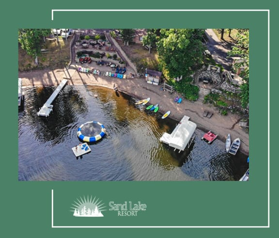 a aerial view of a body of water with boats and a pier