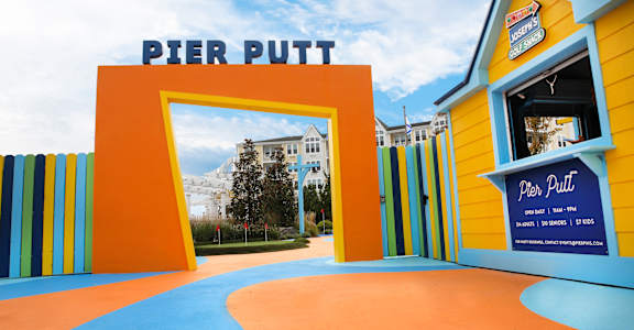 A brightly colored entrance to a place called Pier Putt.