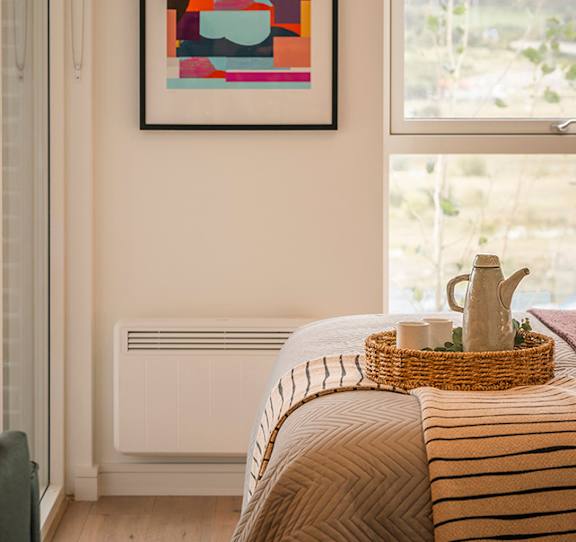 A bedroom with a bed, basket, and a painting on the wall at Cherrywood Apartments, D18 VY3V, DUBLIN 18