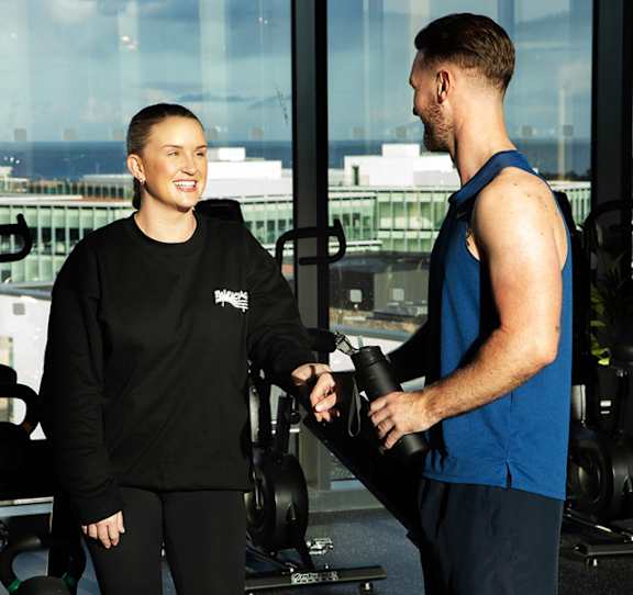 A series of treadmills are lined up in a row.