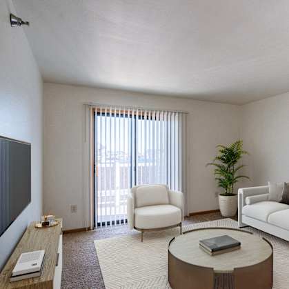 a living room with a couch and a coffee table. Grand Forks, ND Autumn Ridge Apartments