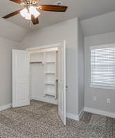 A kitchen with a granite countertop and wooden cabinets. at Cedar Crest Apartments, Farmington, AR, 72730
