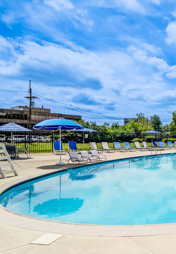 A large outdoor swimming pool with sun loungers at Premier at Cherry Hill, New Jersey