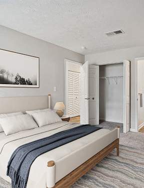 a bedroom with a bed and a closet