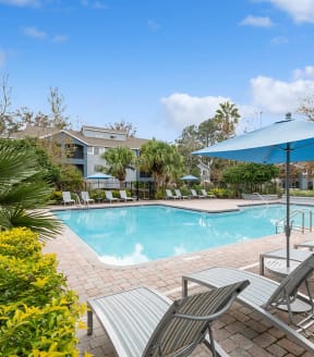 Community Swimming Pool with Pool Furniture at Westland Park Apartments in Jacksonville, FL-SMLAM.