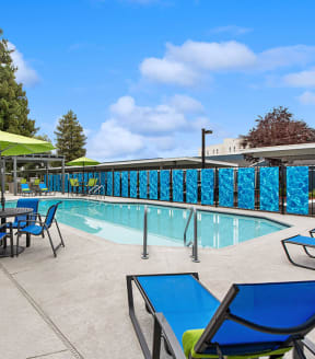 Community Swimming Pool with Pool Furniture at Meritage Apartments in Vallejo, CA-SMLAM.