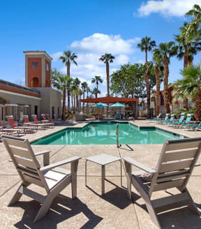 Community Swimming Pool with Pool Furniture at Stonegate Apartments in Las Vegs, NV-SMLAM.